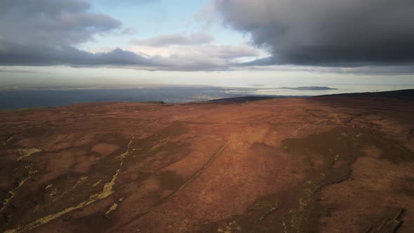 Distant View Of Dublin City From Wicklow Mountains In Ireland On A Cloudy Weather - ascending drone alt
