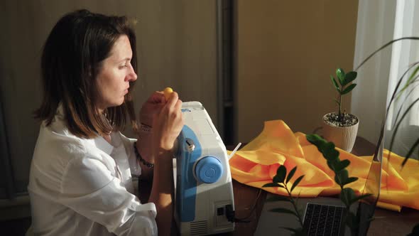 Woman Learning Online Sewing