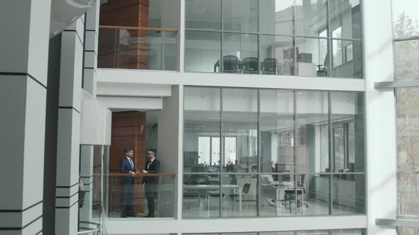 Male Lawyers Talking in Office alt