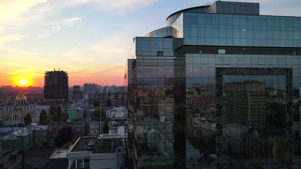 Reflection of the city in the windows of a glass building in the city center