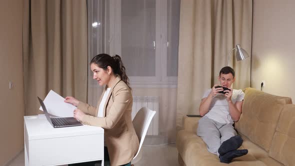 Lady Talks on Video Call and Throws Paper Ball Into Husband alt