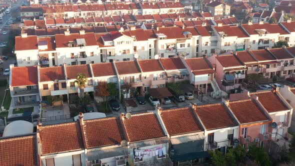 Rows of terrace houses in a mill town. Townhouses with red roofs in a company village or monotown alt
