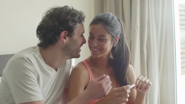 Couple pleased with pregnancy test results