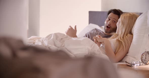 Blonde Woman and Man Talking After Sleep