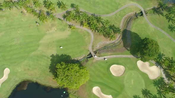 Aerial view of Golf Course with putting green grass and trees alt