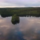 An island in the middle of a glassy lake during sunset - VideoHive Item for Sale