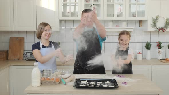 Family Having Fun While Cooking Cookies Together alt