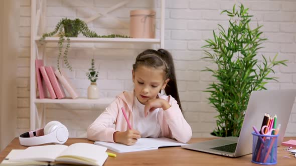 Little Child Girl Using Laptop Computer for Studying Online E-learning System