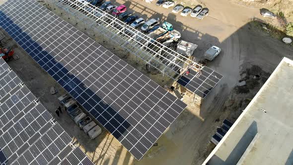 Aerial View Panorama of Solar Panels. Slow Movement of the Camera Over the Panels. Background alt