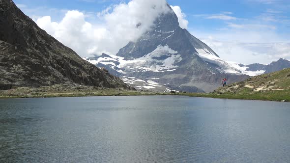 Scenic view on snowy Matterhorn peak and lake Stellisee, Swiss Alps, Zermatt