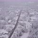 Aerial Flying Over Small Town In Winter Blizzard - VideoHive Item for Sale