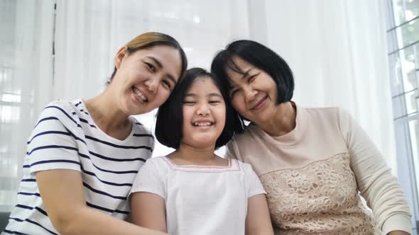 Happy Asian family smiling together at home, Multi generation of female alt