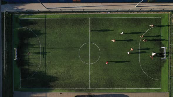 Top view of a Sports soccer field with people playing soccer