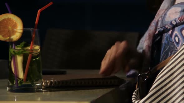 Female Taking Notebook and Pen Out of Bag, Writing Down Poem, Inspiration, Relax alt