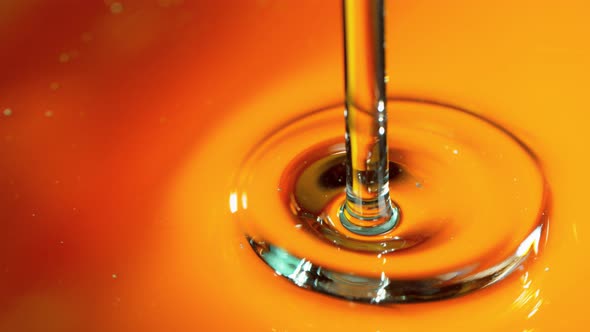 Super Slow Motion Shot of Pouring Golden Gel Liquid at 1000Fps alt