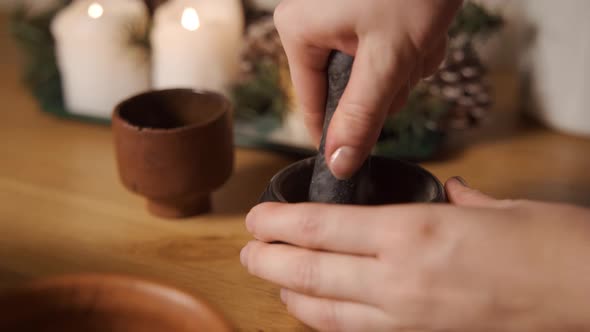 The Top View of a Pestle Spices Peppers and Sea Salt in the Grey Stone Mortar alt