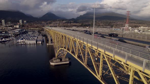 Ironworkers Memorial Bridge with mountainous landscape in background, Vancouver in Canada. Aerial fo alt