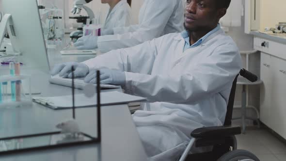 African-American Scientist in Wheelchair Working in Lab, Stock Footage