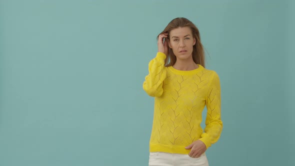 Woman in Yellow Posing alt