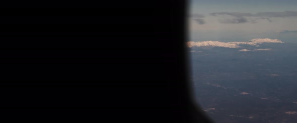 Aerial view of snowy mountain peaks and beautiful landscape. alt