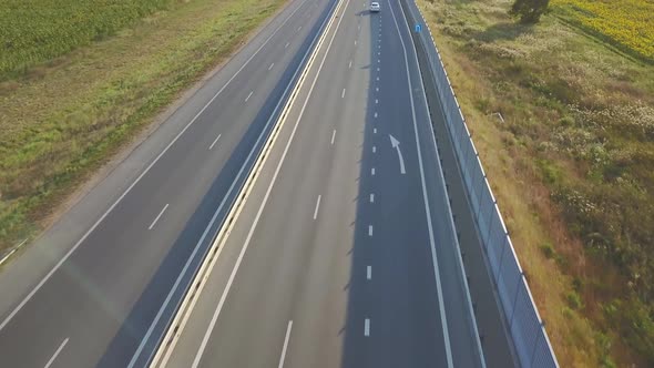 Drone Aerial View Above the Highway in Countryside with Moving Cars