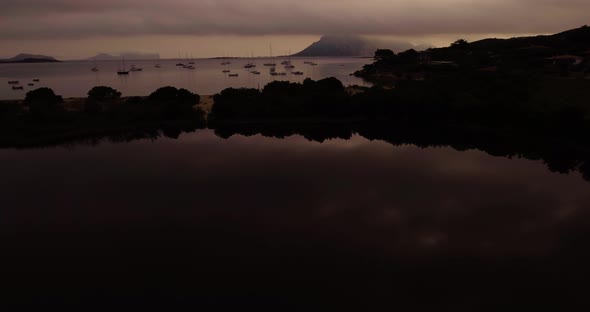 Aerial, Island Silhouettes On A Dark Morning, View On Pond And The Sea Bay In Sardinia Island