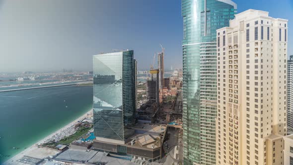 Modern Skyscrapers in Jumeirah Beach Residence in Dubai JBR Aerial Timelapse alt