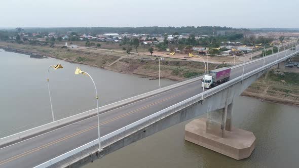 Aerial Footage of The Third Thai–Lao Friendship Bridge over the Mekong River, is a bridge that conne alt