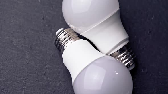 LED light bulbs on table with dark background alt