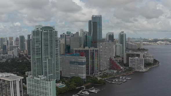 Aerial at building level pan of downtown Miami landscape alt