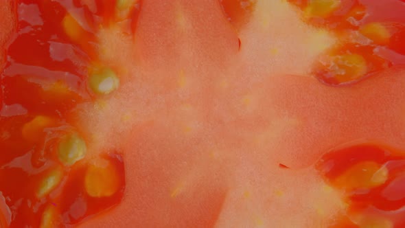Macro shot of Tomato slice rotation, Close up