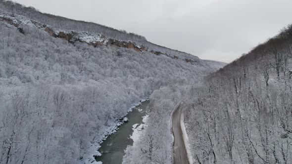 Aerial View of Plateau LagoNaki Mountain Twisted Road in the Winter and Driving Car alt