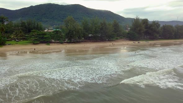 aerial shot of an island in south-east asia in which the drone is slowly moving backwards and rising alt