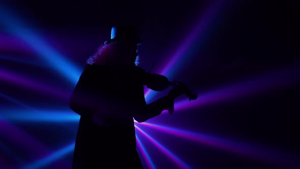 Bottom View Virtuoso Performance By a Violinist in a Dark Studio with Blinking Blue Violet Beams of alt