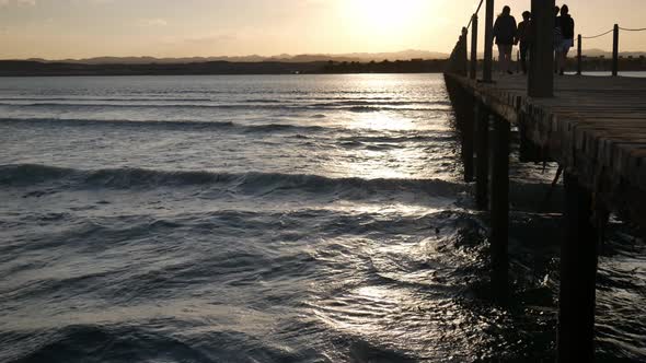 Family Walking on a Pier at Sunset. Red Sea Coast, Marsa Alam, Egypt