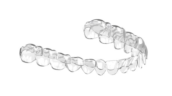 Invisalign removable and invisible retainer over white background ...