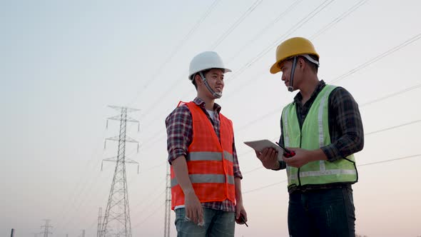 Two engineers electric experts discussed the construction of a power line