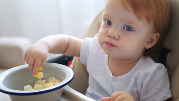 Child Eating Carrot and Other Vegetables By Himself, Self-feeding.