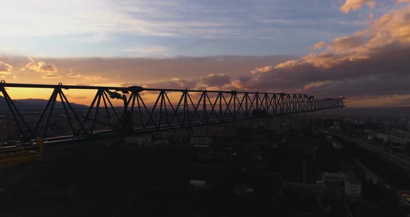 Crane Silhouette Against Beautiful Scenic Sunset Landscape with Magnificent Clouds alt