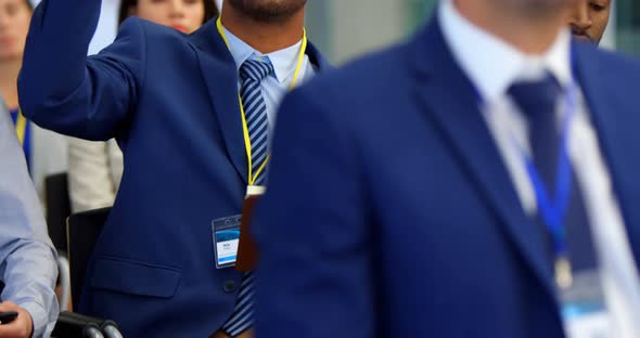 Businessman raising his hand in the business seminar 4k alt