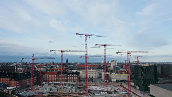 Cityscape Aerial Shot and Industrial Cranes in the Center of Copenhagen, Denmark alt