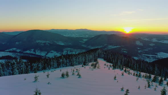 An Extraordinary Valley with Hills and Mountains Covered with Fir Forests Against the Backdrop of a alt