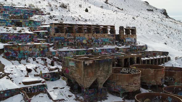 A drone orbits the rusty Old Tintic Mill in Geneloa, Utah, revealing the decaying water tanks, leach alt