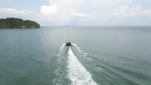Travel Boat with Tourists Departing From the Harbor of Railay Beach Krabi Thailand Following alt