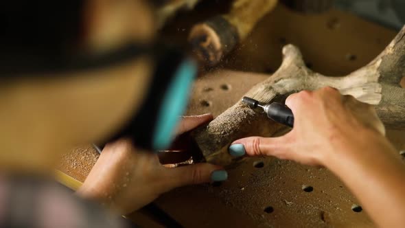 Female Using Power Wood Working Tools Graver Carving While Crafting