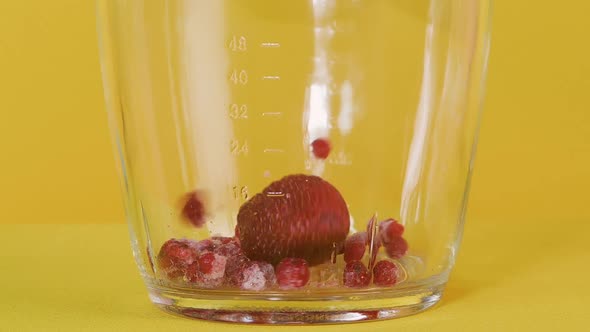 Fresh Berries Are Put in a Blender. Preparation of Cocktails, Smoothies and Purees. Slow Motion