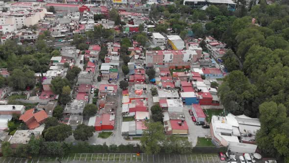 Aerial view of El Manantial in Peña Pobre neighborhood, southern Mexico City. Drone flying forward alt