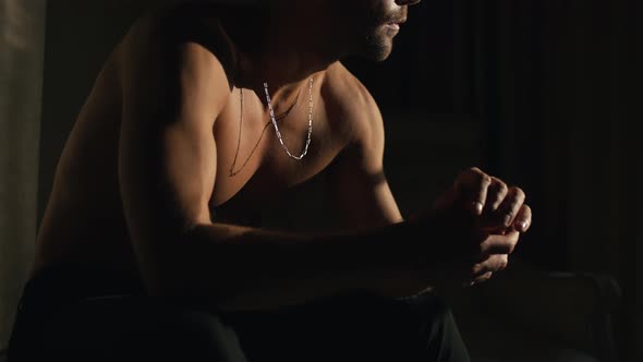 Brutal Naked Guy Sitting and Thinking