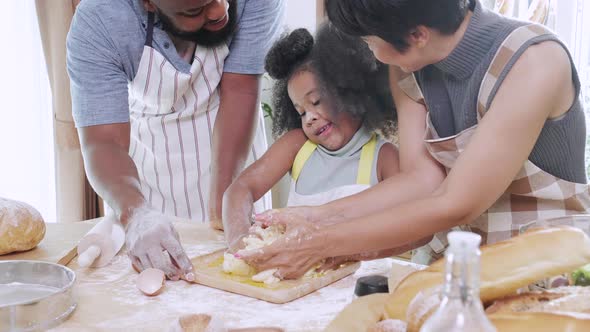 Close up of Happy African American family helping for make dough together for cookie
