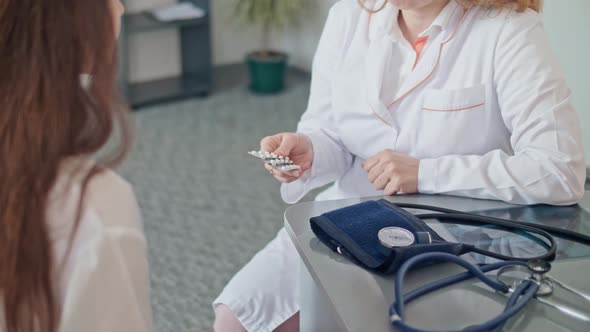 Consulting of Patient at Clinic. Medical Professionals at Work. Doctor Discusses Further Treatment. alt